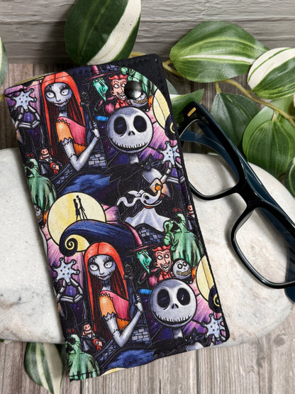 Glasses Case with Nightmare before Christmas characters on marble with glasses and leaves.