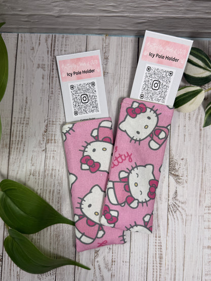 Fabric Icy Pole Holder with Hello Kitty design on a wooden surface.