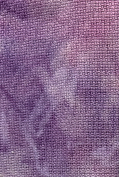 Close-up of purple cross stitch aida fabric texture