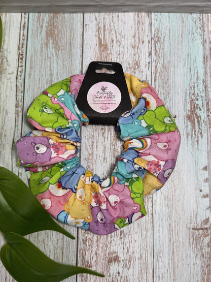 Colorful scrunchie with cartoon characters on a wooden surface