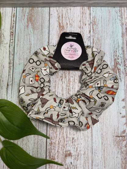 Scrunchie with pattern on a wooden surface with a plant leaf