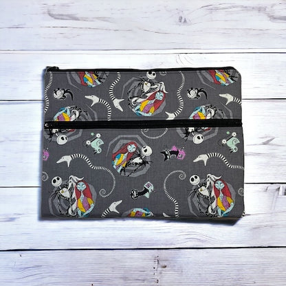 Ipad/tablet sleeve with Jack and Sally pattern on a wooden surface