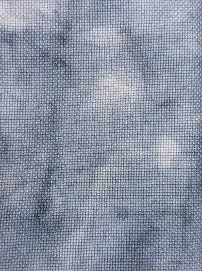 Close-up of a textured aida cross sttich  blue fabric with a grid pattern